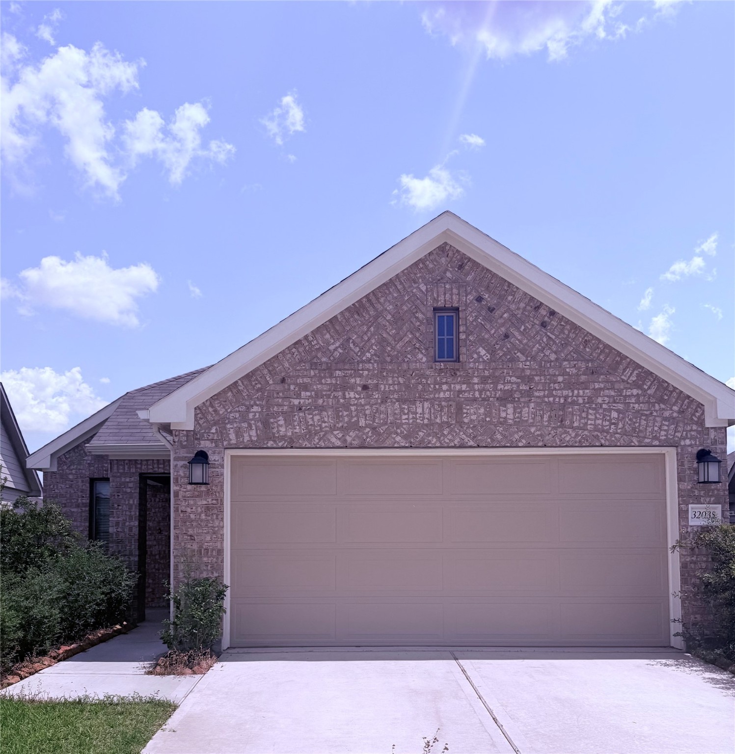 a front view of a house with yard
