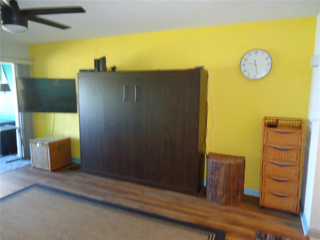 4550 Cove Circle, Unit 405 Madeira Beach, FL 33708 - Photo 5 of 20 a view of a door and wooden floor