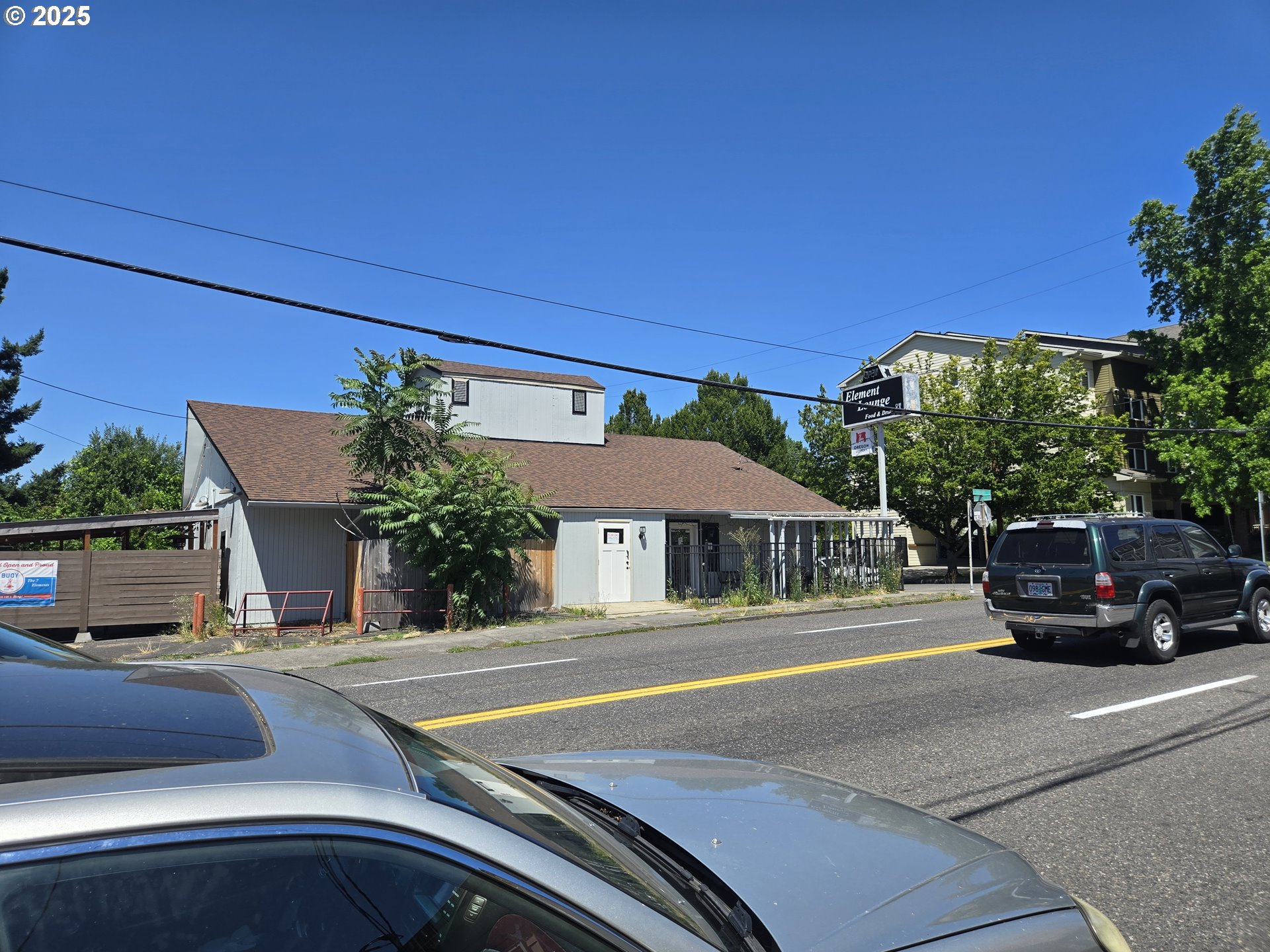 5842 East Burnside Street Portland, OR 97215 - Photo 3 of 7 a car parked in front of a house