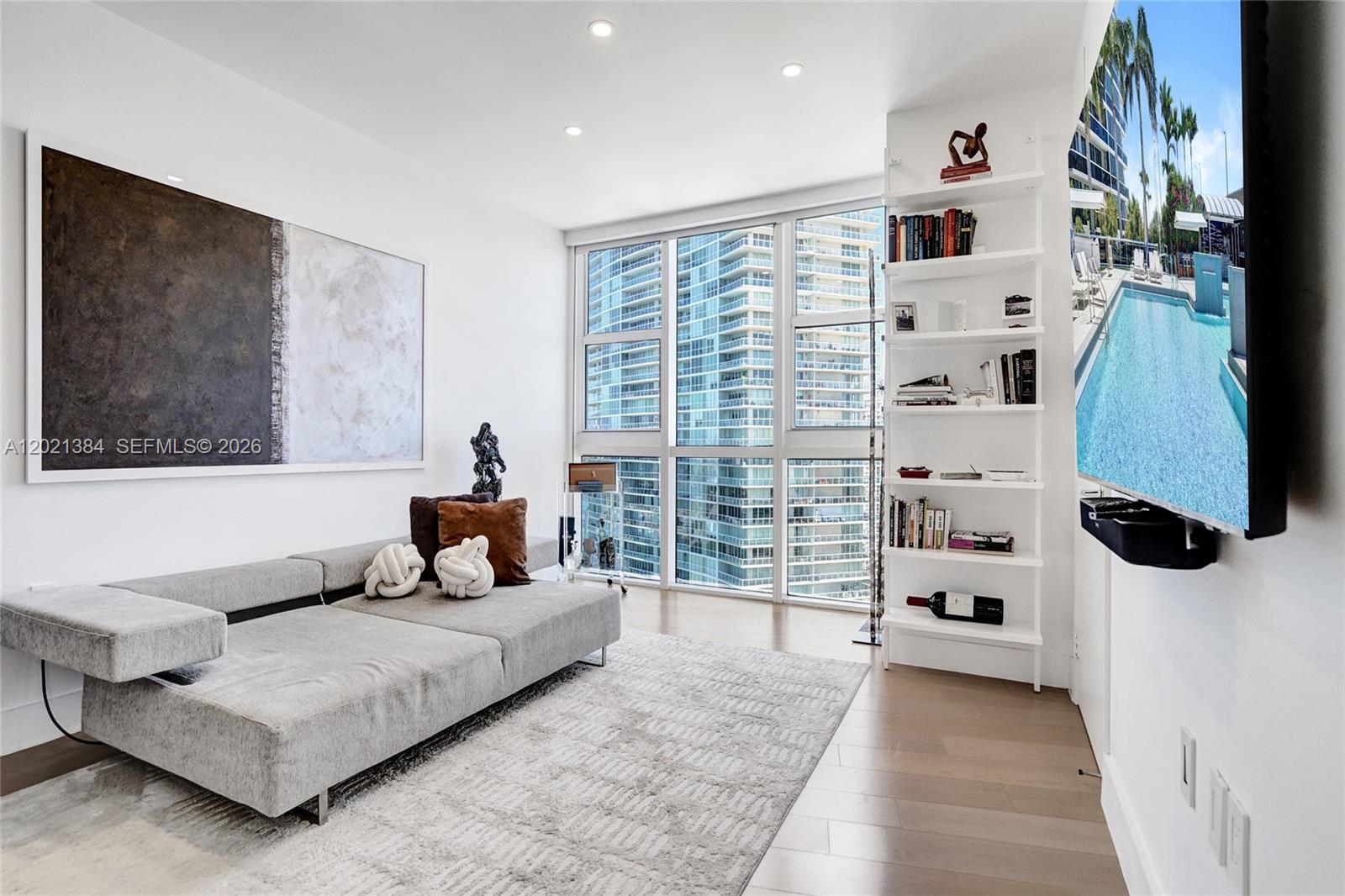 400 Alton Road, Unit PH11 Miami Beach, FL 33139 - Photo 35 of 49 a living room with furniture and a flat screen tv