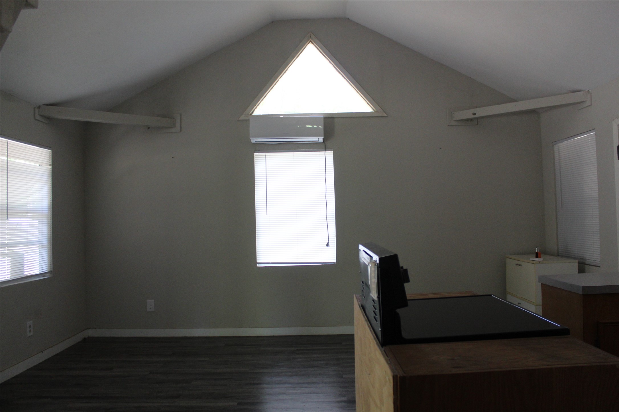 400 Carson Roberson Road Livingston, TX 77351 - Photo 11 of 19 a view of an empty room with wooden floor and a window