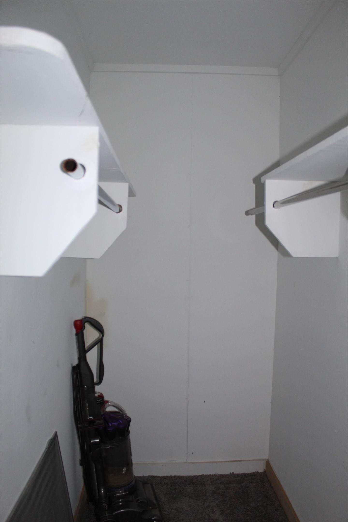 400 Carson Roberson Road Livingston, TX 77351 - Photo 18 of 19 a room with water heater and wooden floor