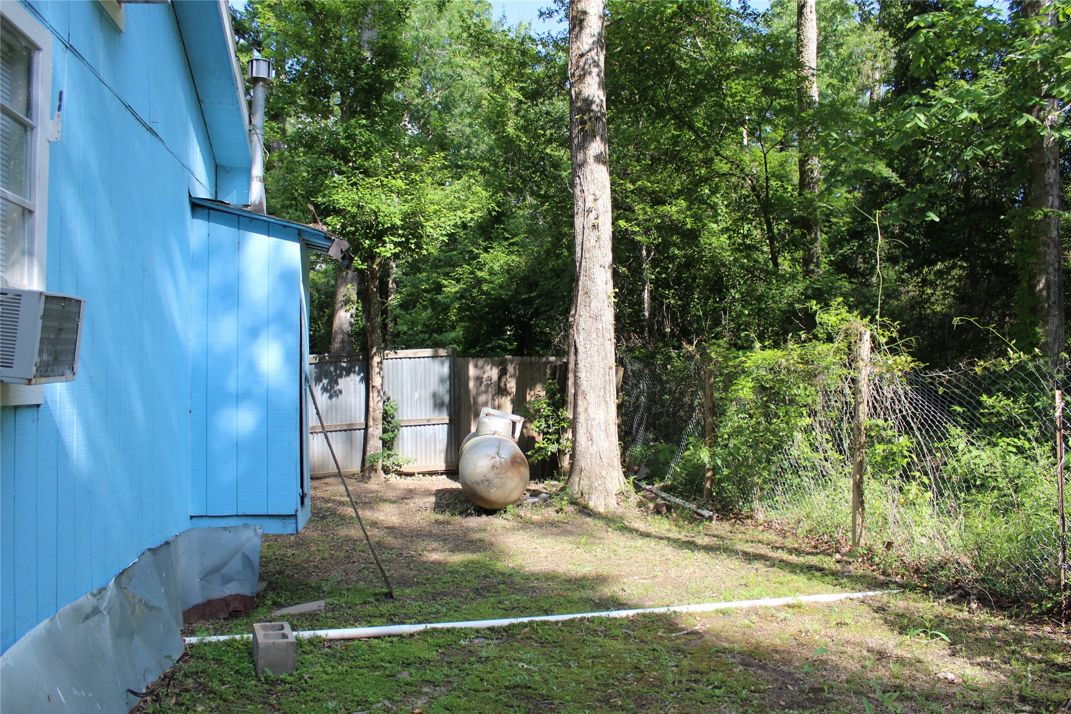 400 Carson Roberson Road Livingston, TX 77351 - Photo 5 of 19 a view of a house with backyard and trees