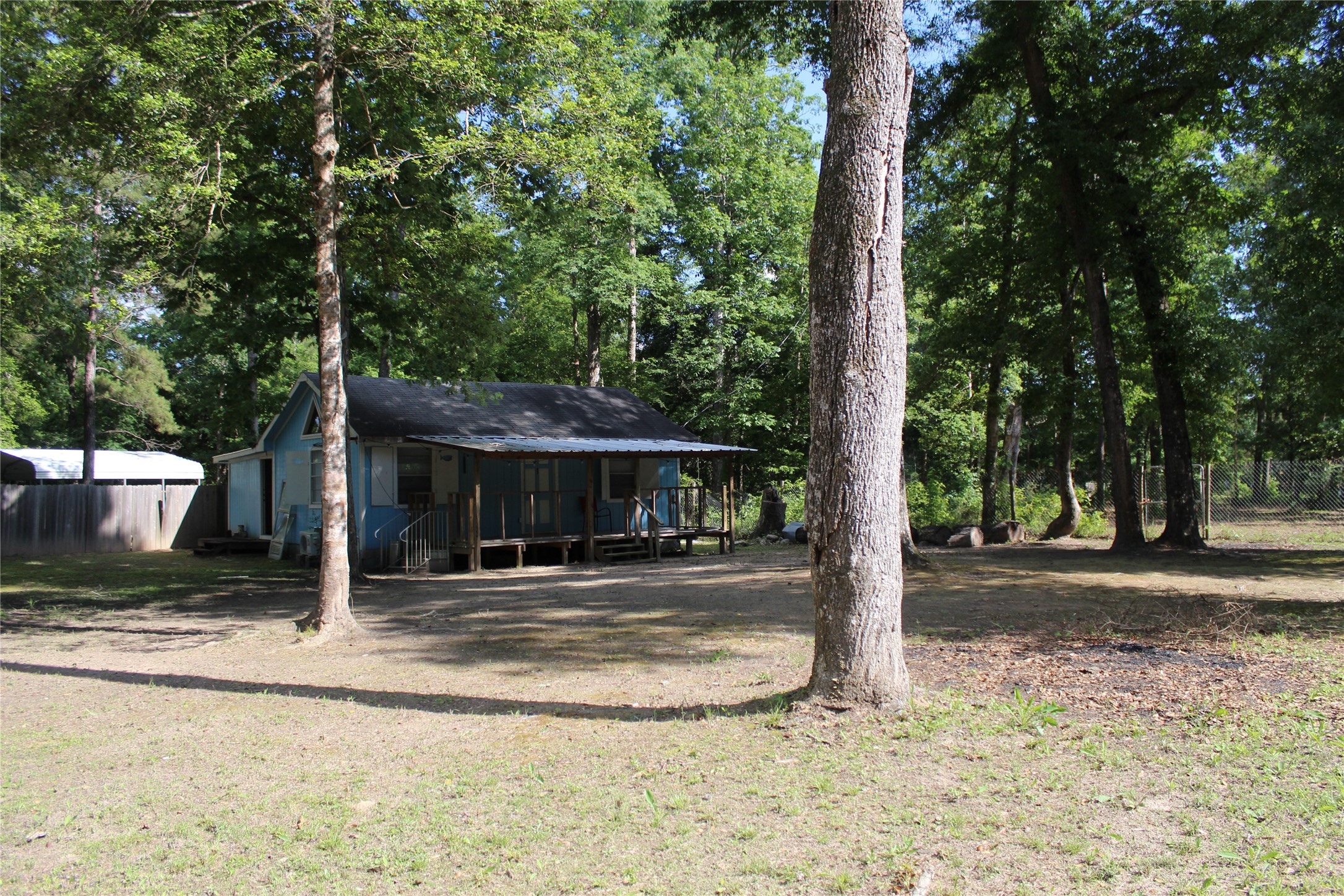 400 Carson Roberson Road Livingston, TX 77351 - Photo 6 of 19 a house with trees in the background