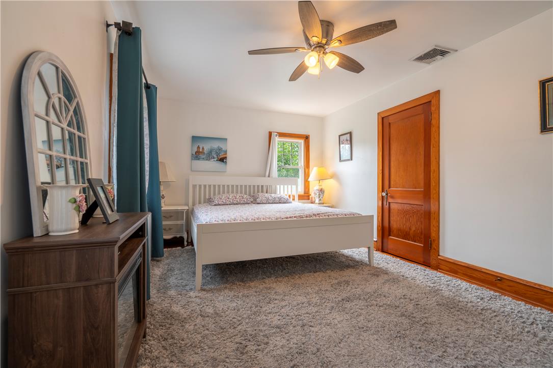 665 Point Phillips Road Bath, PA 18014 - Photo 30 of 73 A tranquil bedroom provides comfort with soft carpeting and a classic ceiling fan for ultimate relaxation.