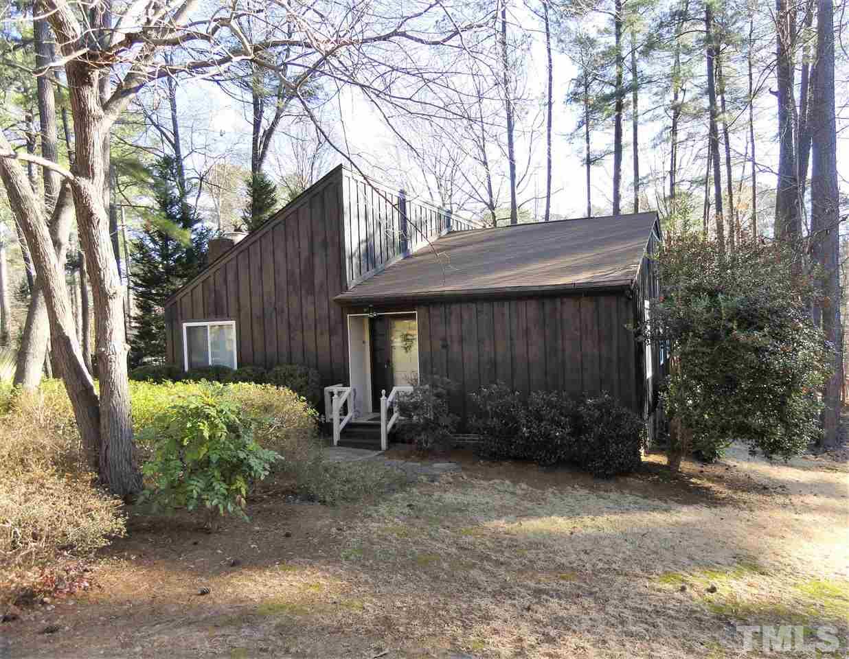 403 Ryan Road Cary, NC 27511 - Photo 1 of 21 Cedar siding, one story home with a brick fireplace.