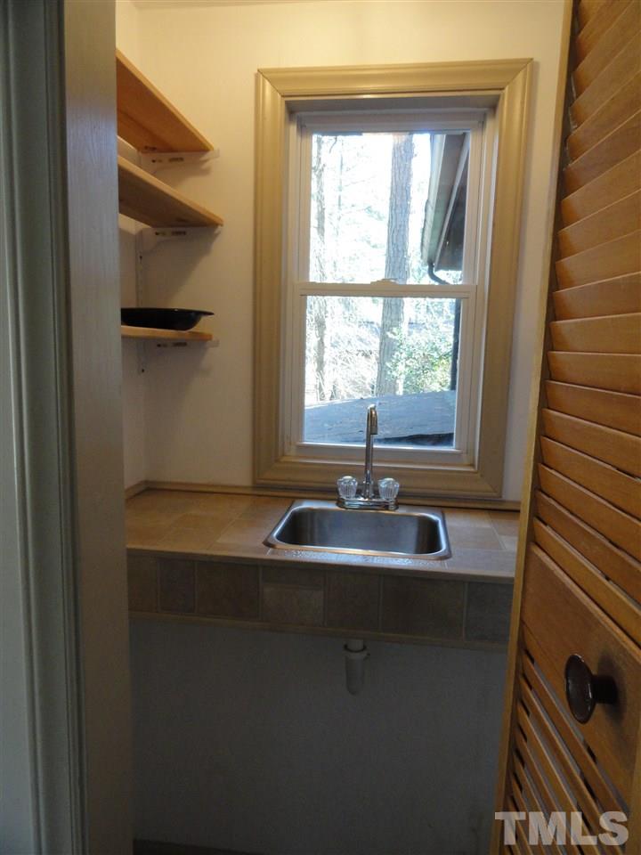 403 Ryan Road Cary, NC 27511 - Photo 11 of 21 A wet bar is located in a closet off the family room.