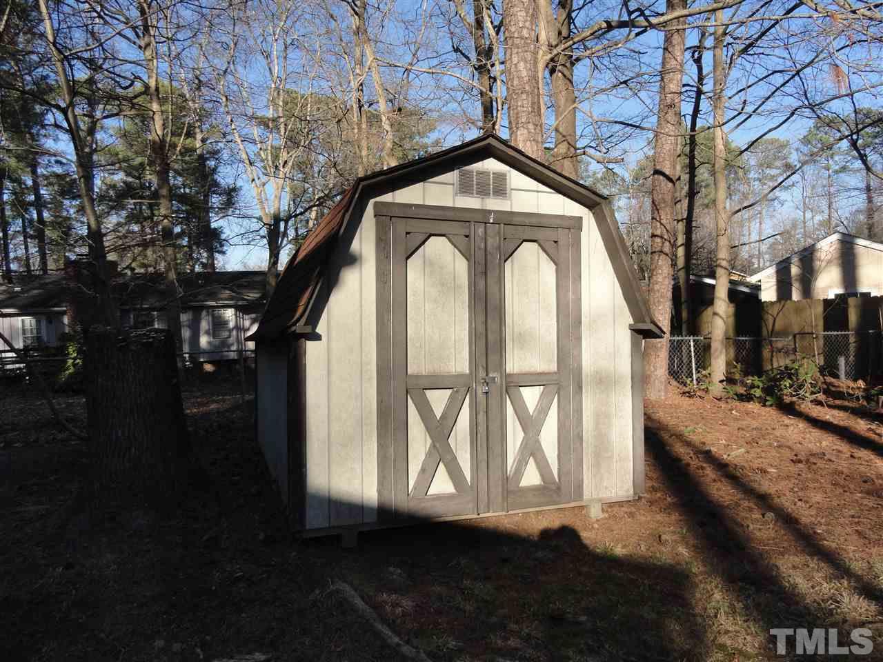 403 Ryan Road Cary, NC 27511 - Photo 19 of 21 The shed in the back yard offers good storage.