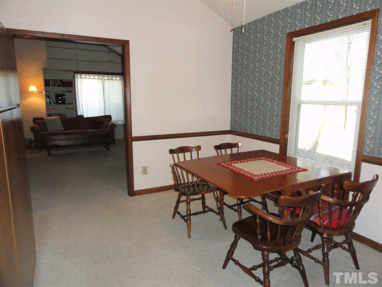 403 Ryan Road Cary, NC 27511 - Photo 6 of 21 The dining area is located off the living room.