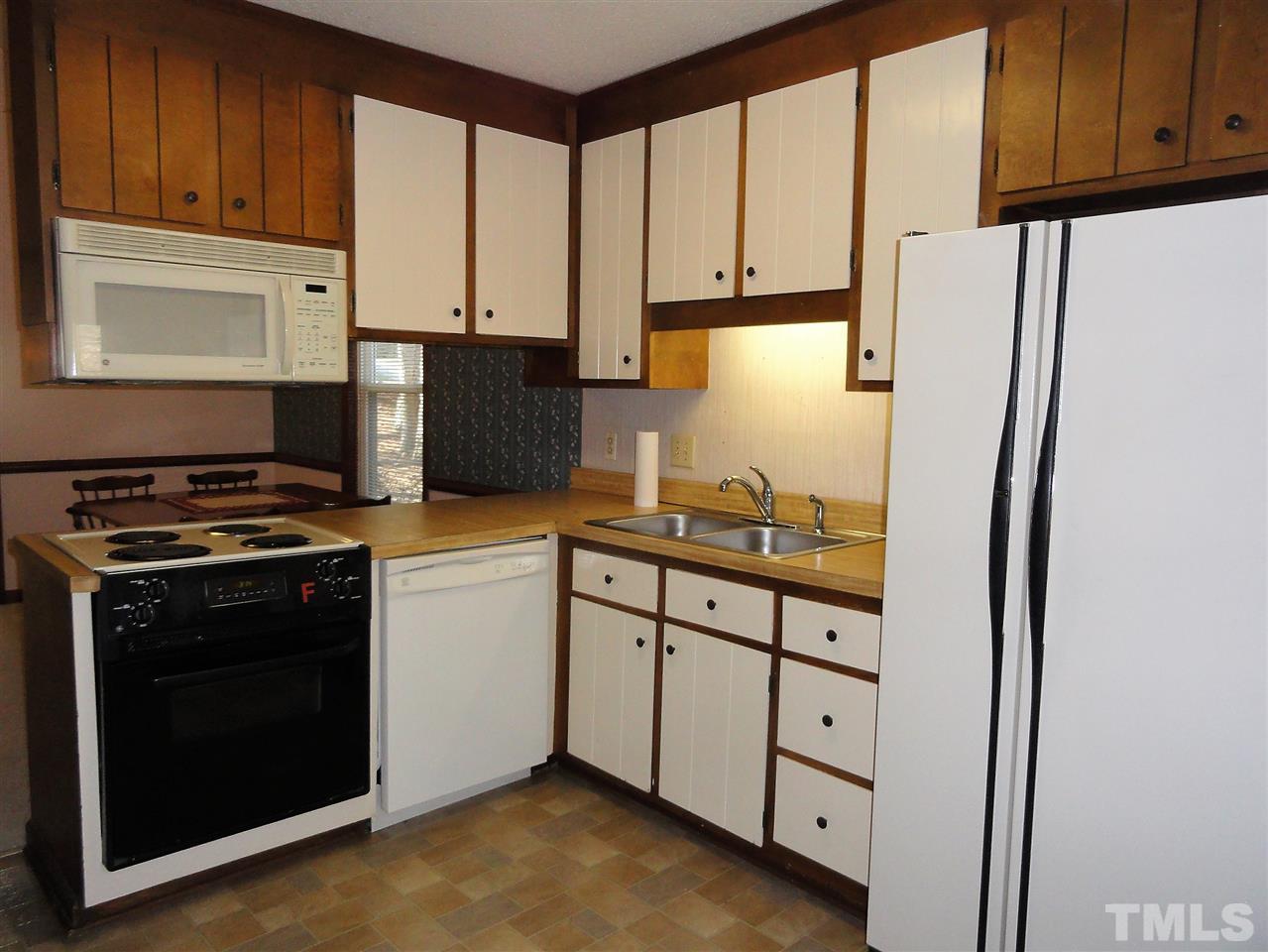 403 Ryan Road Cary, NC 27511 - Photo 7 of 21 The kitchen refrigerator stays with the house.