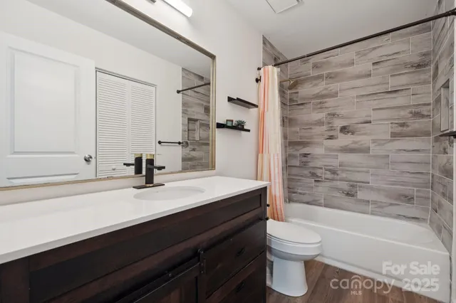 a bathroom with a sink a toilet and a bathtub