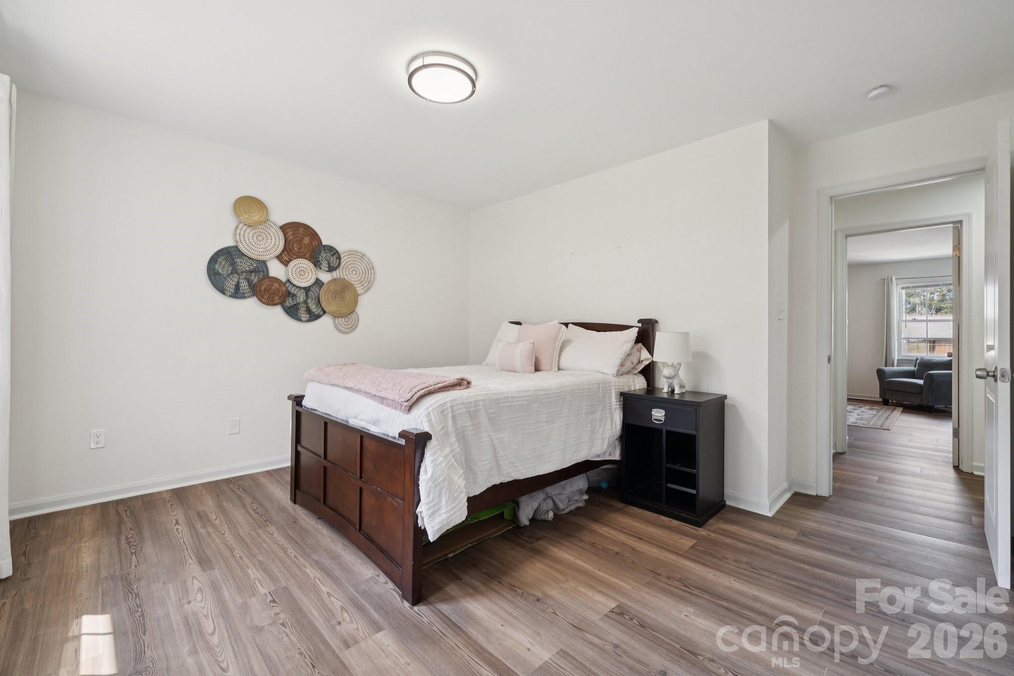 8838 Hunter Ridge Drive Charlotte, NC 28226 - Photo 20 of 27 a bedroom with a bed and a view of bedroom