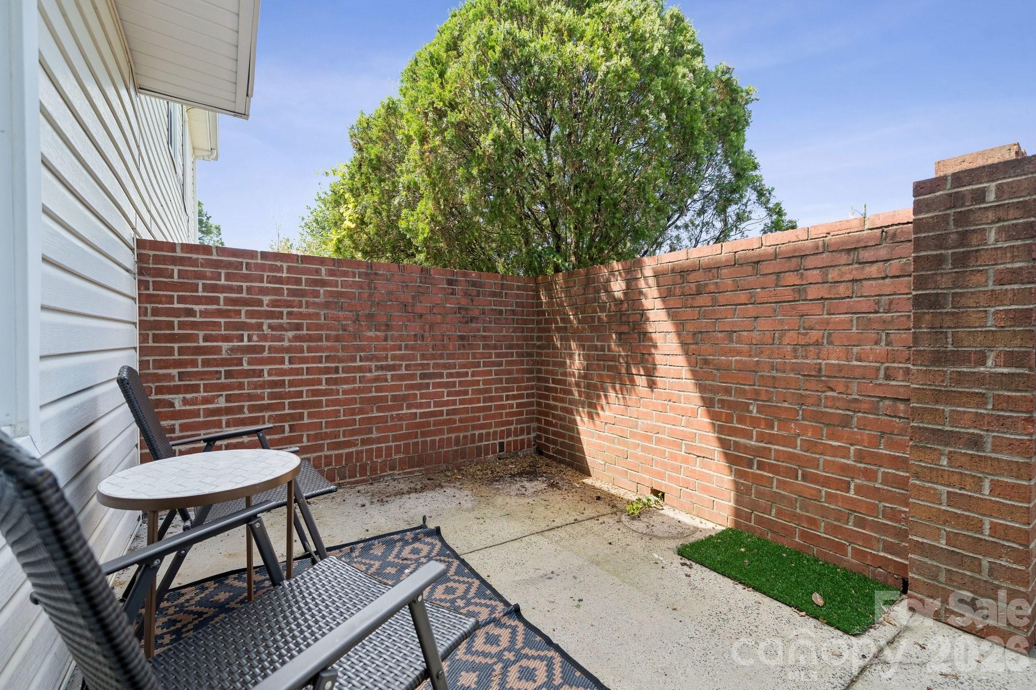 8838 Hunter Ridge Drive Charlotte, NC 28226 - Photo 23 of 27 a backyard of a house with table and chairs