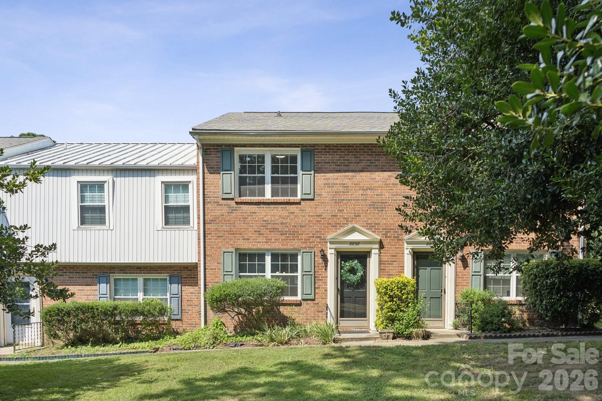 8838 Hunter Ridge Drive Charlotte, NC 28226 - Photo 27 of 27 a front view of a house with a garden