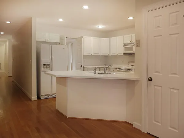 a view of kitchen with wooden floor