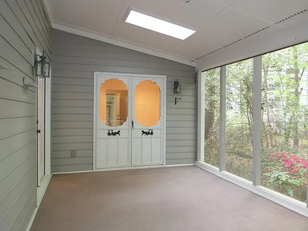 a view of a room that has a large window