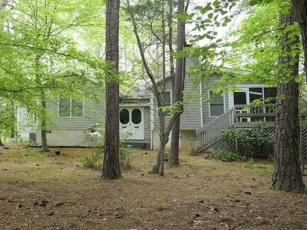 a view of a tree in front of a house