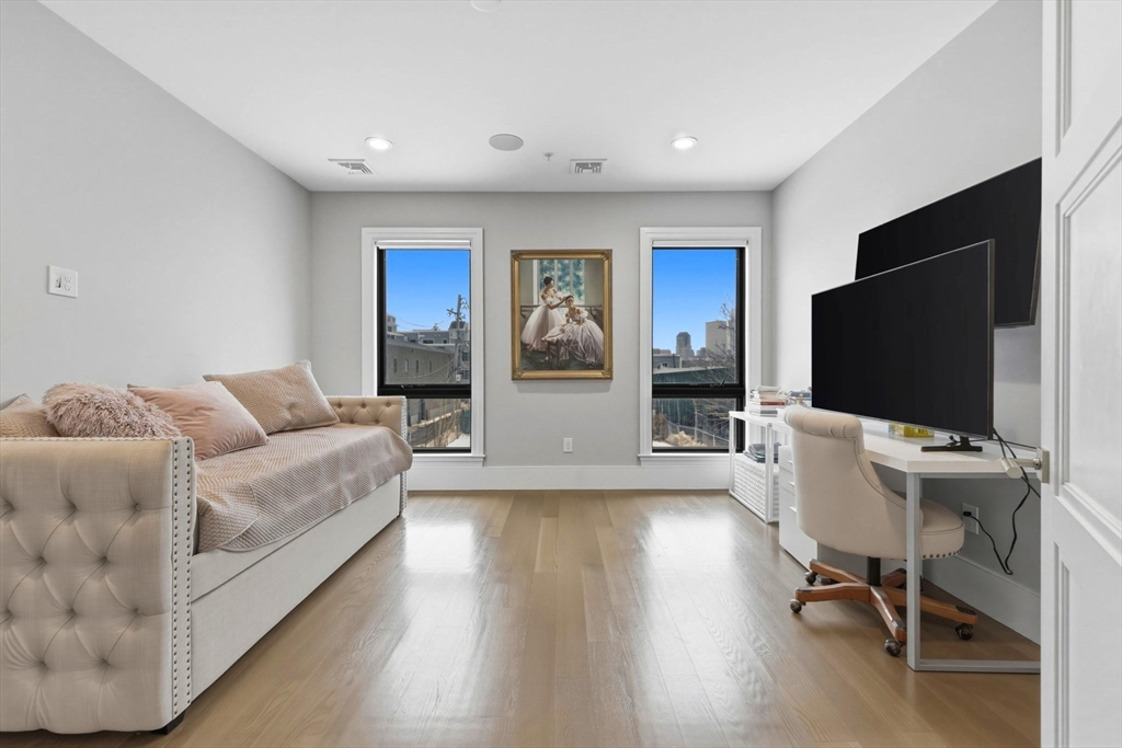 377 West First Street, Unit 5 Boston, MA 02127 - Photo 22 of 27 a living room with furniture and a flat screen tv