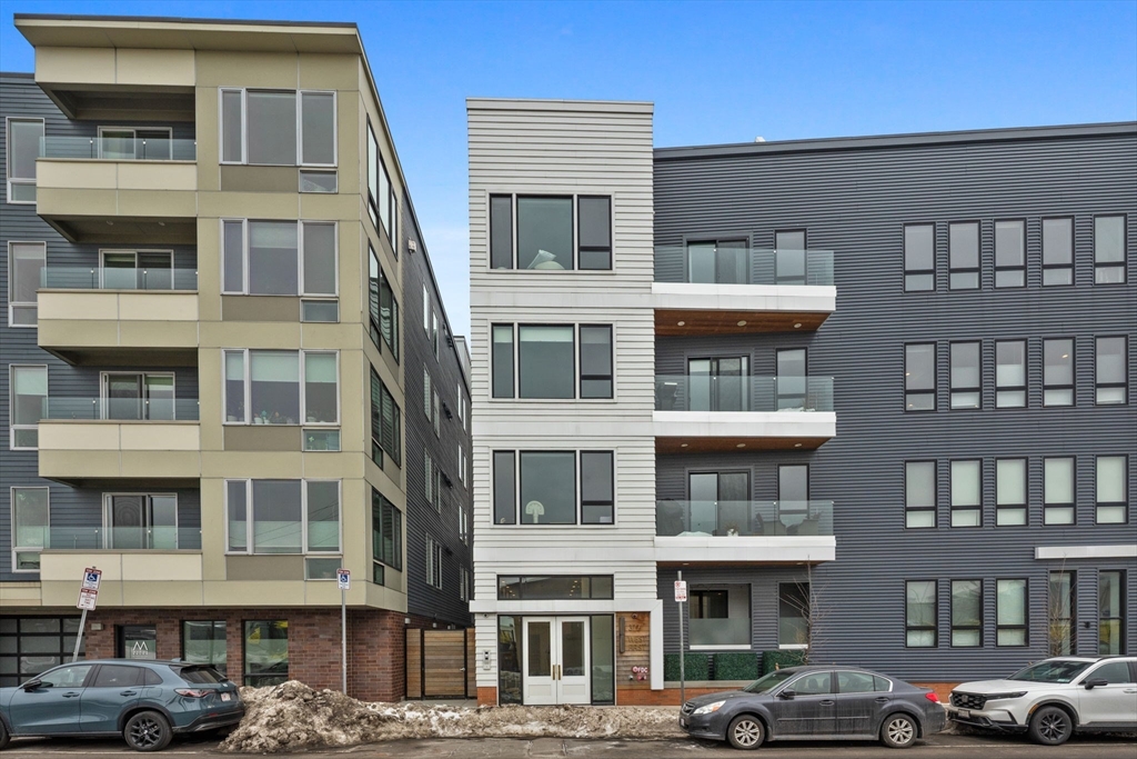 377 West First Street, Unit 5 Boston, MA 02127 - Photo 25 of 27 a front view of a building with a lot of windows