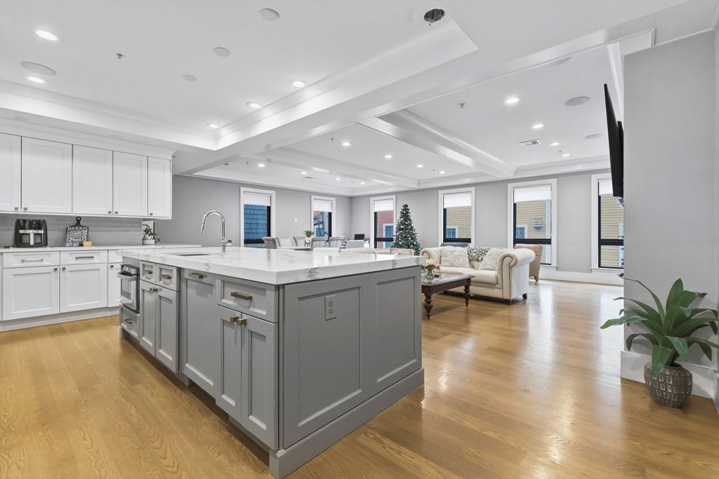 377 West First Street, Unit 5 Boston, MA 02127 - Photo 3 of 27 a kitchen with appliances cabinets and a counter top space