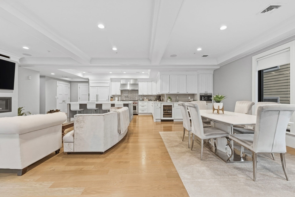 377 West First Street, Unit 5 Boston, MA 02127 - Photo 10 of 27 a living room with lots of furniture and kitchen view