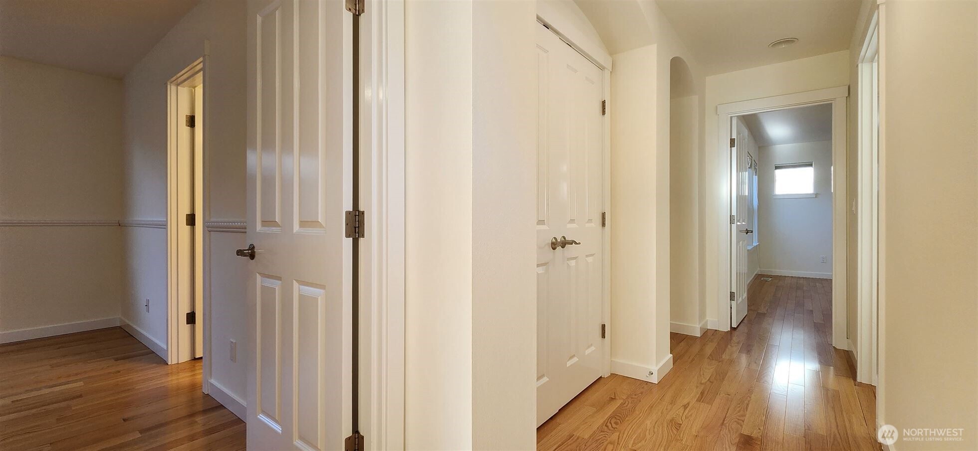 24202 Southeast 21st Street Sammamish, WA 98075 - Photo 14 of 26 a view of a hallway with wooden floor