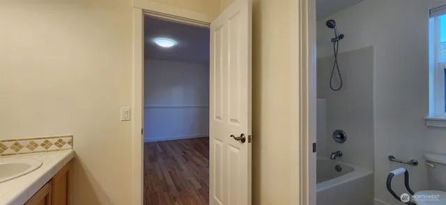 a bathroom with a bathtub and shower