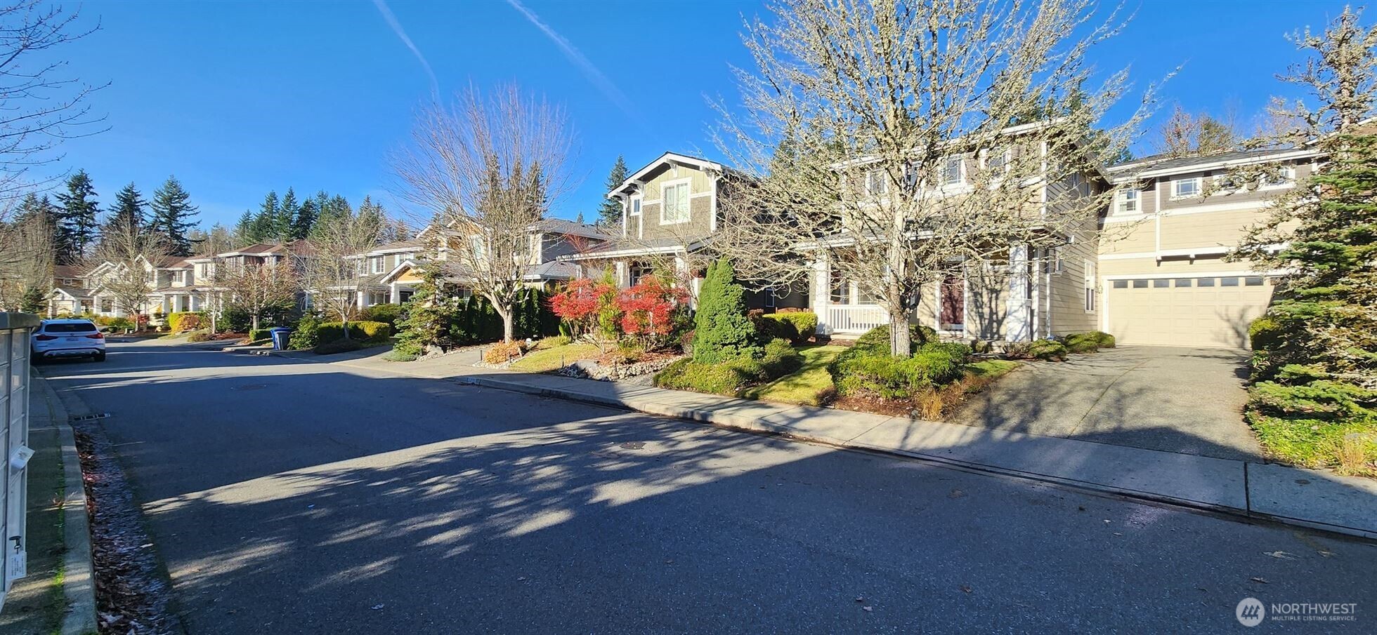 24202 Southeast 21st Street Sammamish, WA 98075 - Photo 2 of 26 a view of a street with a building in the background