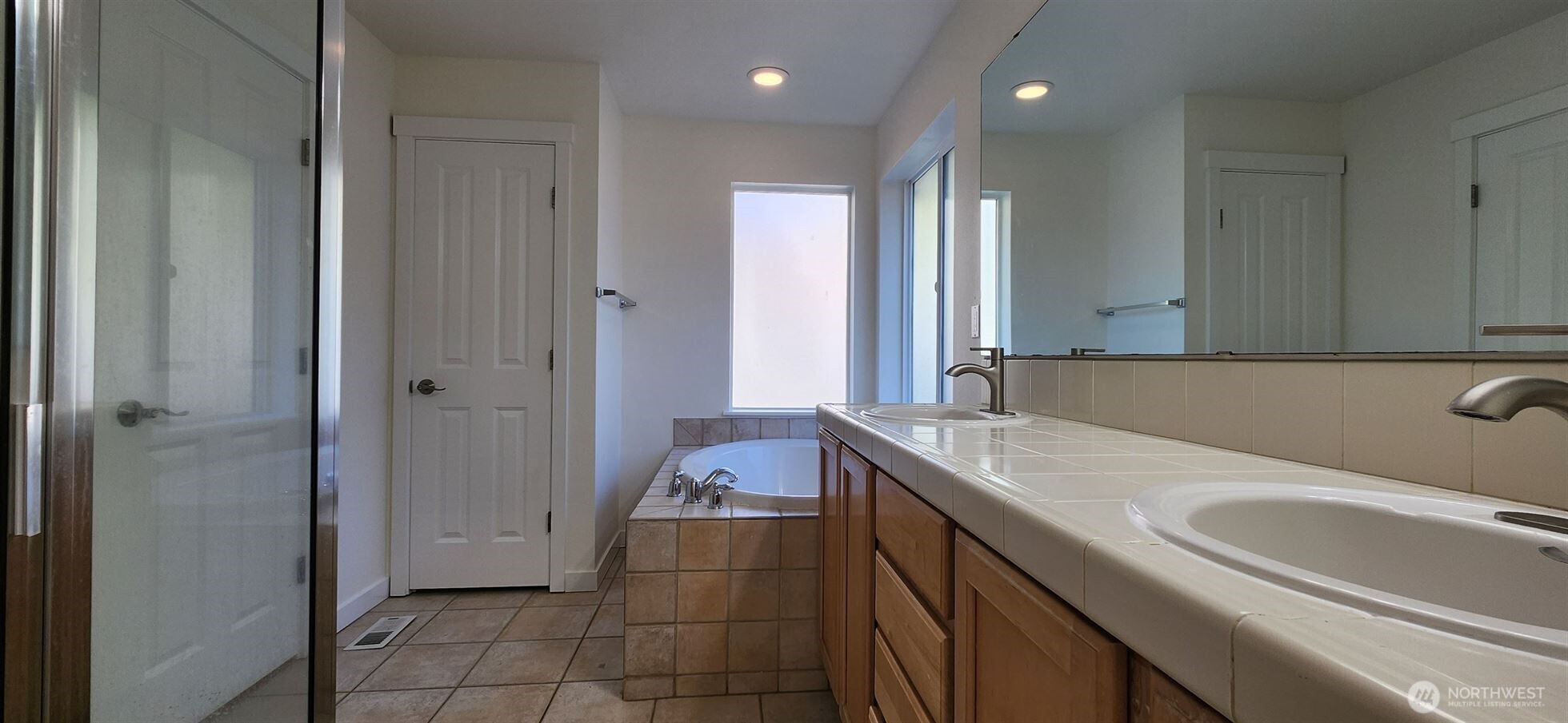 24202 Southeast 21st Street Sammamish, WA 98075 - Photo 24 of 26 a bathroom with a sink and a mirror