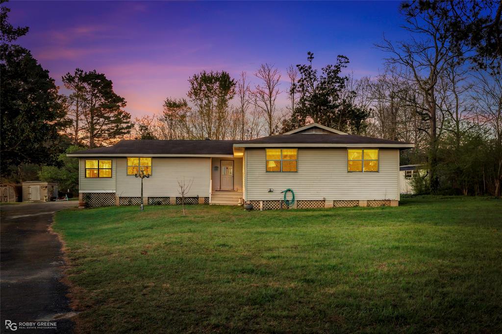 251 Tom Murphy Road Jamestown, LA 71045 - Photo 1 of 40 a front view of house with yard and trees