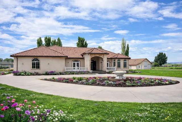 a front view of house with yard and green space