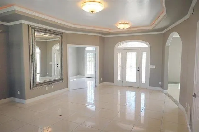 a kitchen with stainless steel appliances kitchen island granite countertop a refrigerator and a stove