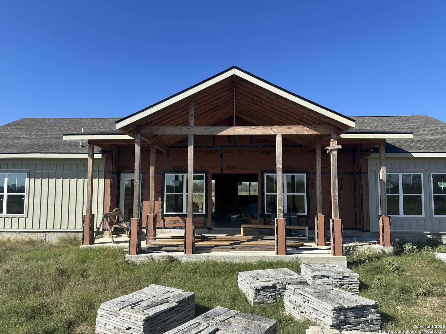 front view of a house with a yard