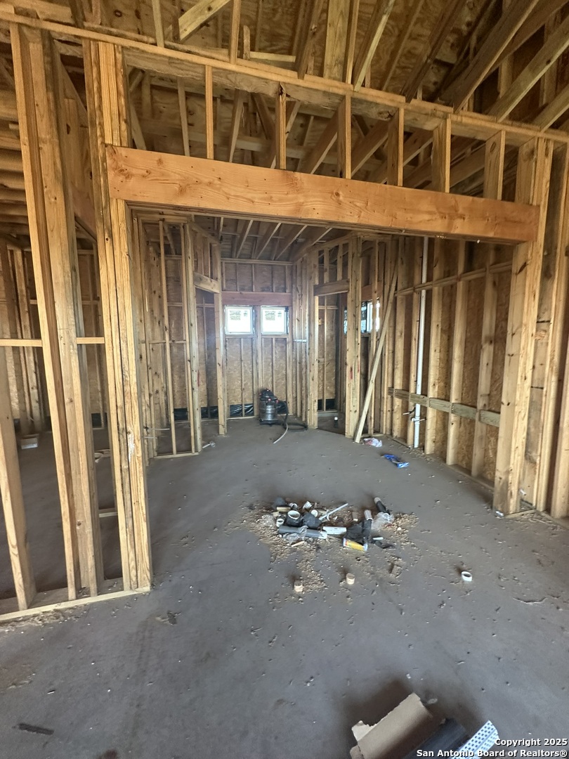 241 County Road 154 Pleasanton, TX 78064 - Photo 12 of 20 a view of a building with potted plants in front of door