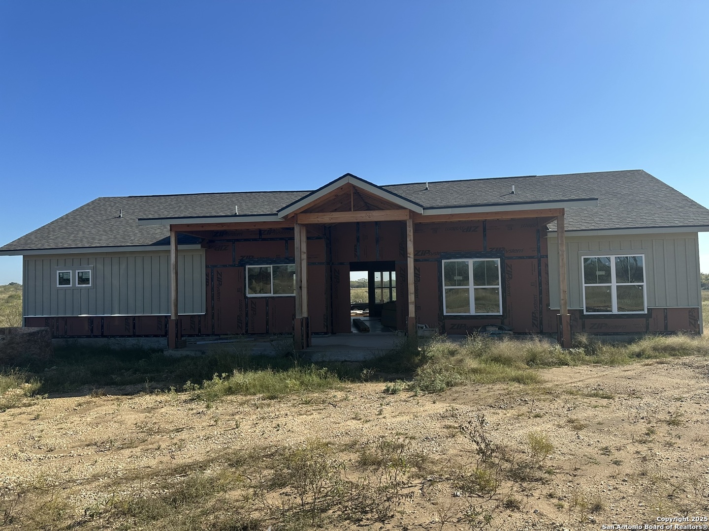 241 County Road 154 Pleasanton, TX 78064 - Photo 4 of 20 a front view of a house with a yard