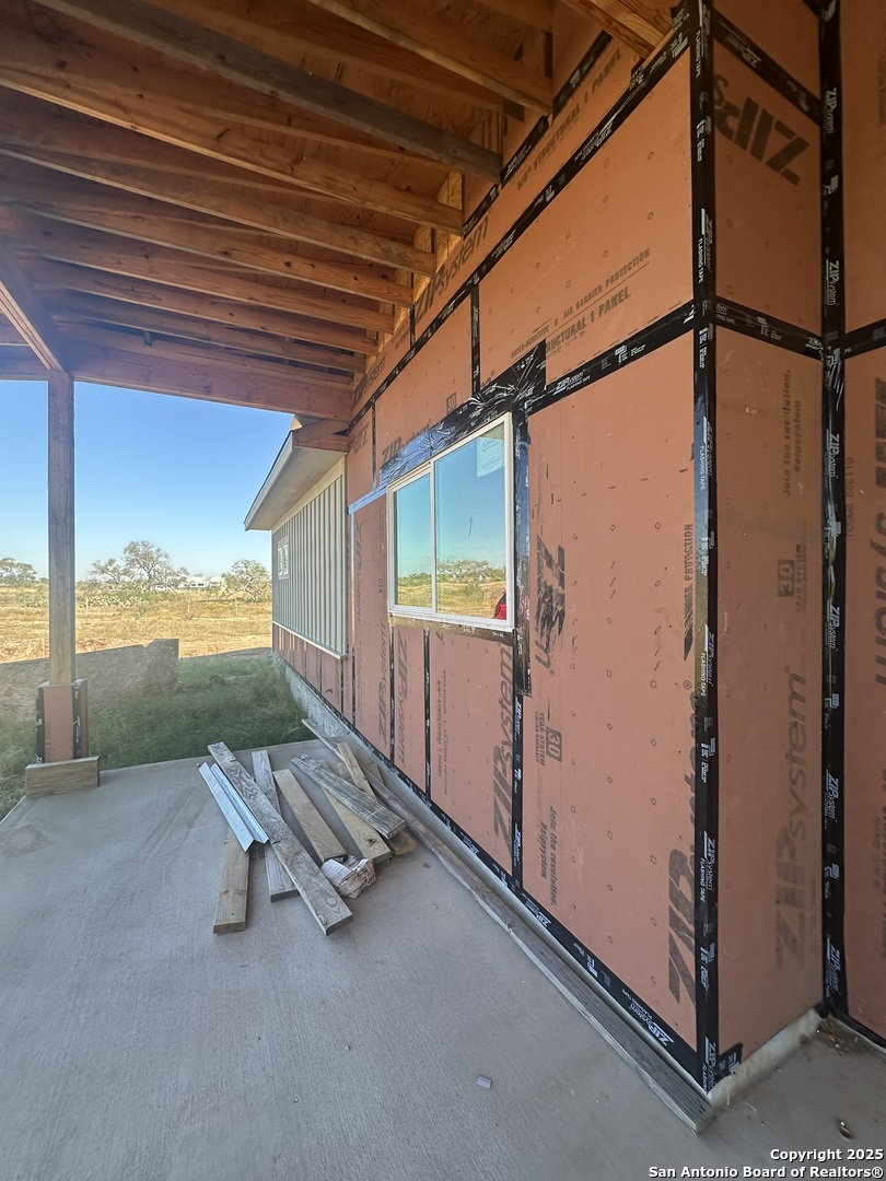 241 County Road 154 Pleasanton, TX 78064 - Photo 8 of 20 a view of a room with wooden floor and windows