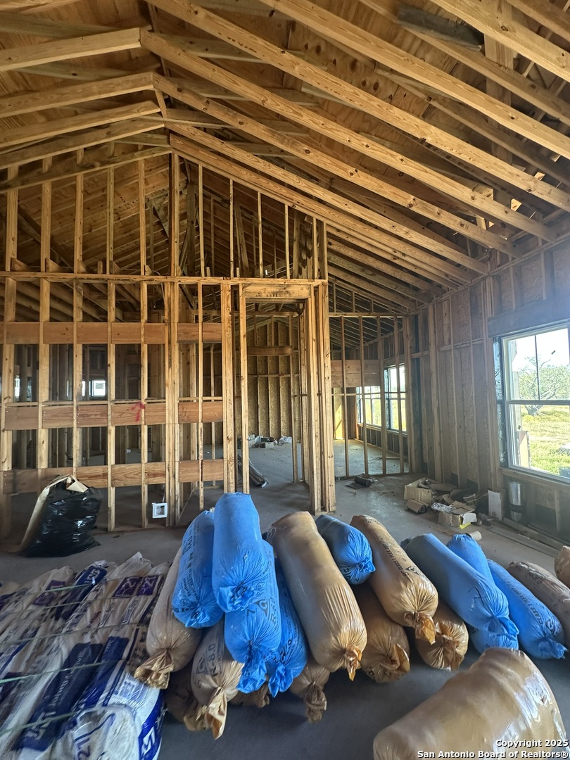 241 County Road 154 Pleasanton, TX 78064 - Photo 10 of 20 a bed sitting in a bedroom next to a window