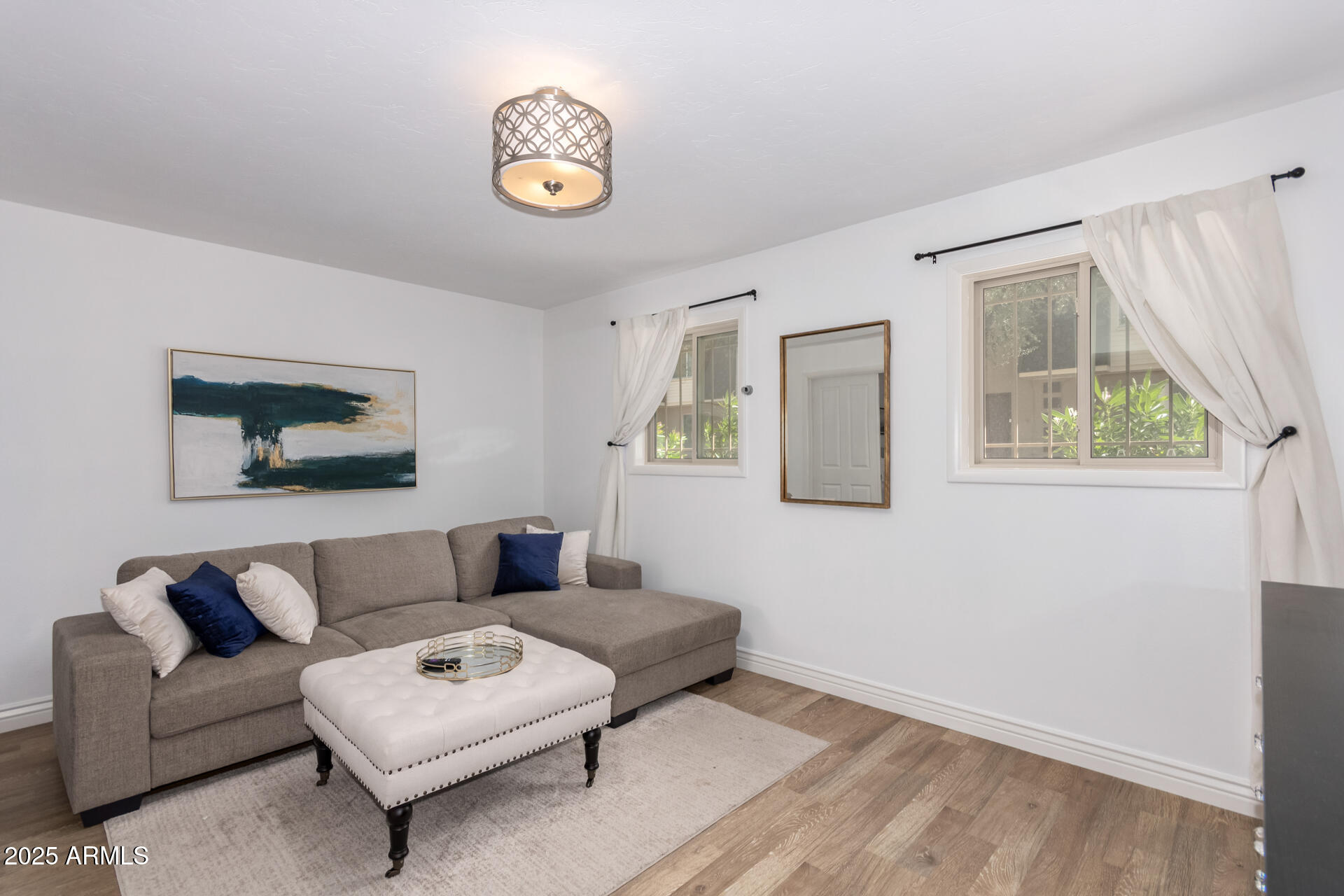 8490 East Chaparral Road Scottsdale, AZ 85250 - Photo 16 of 27 a living room with furniture and a window