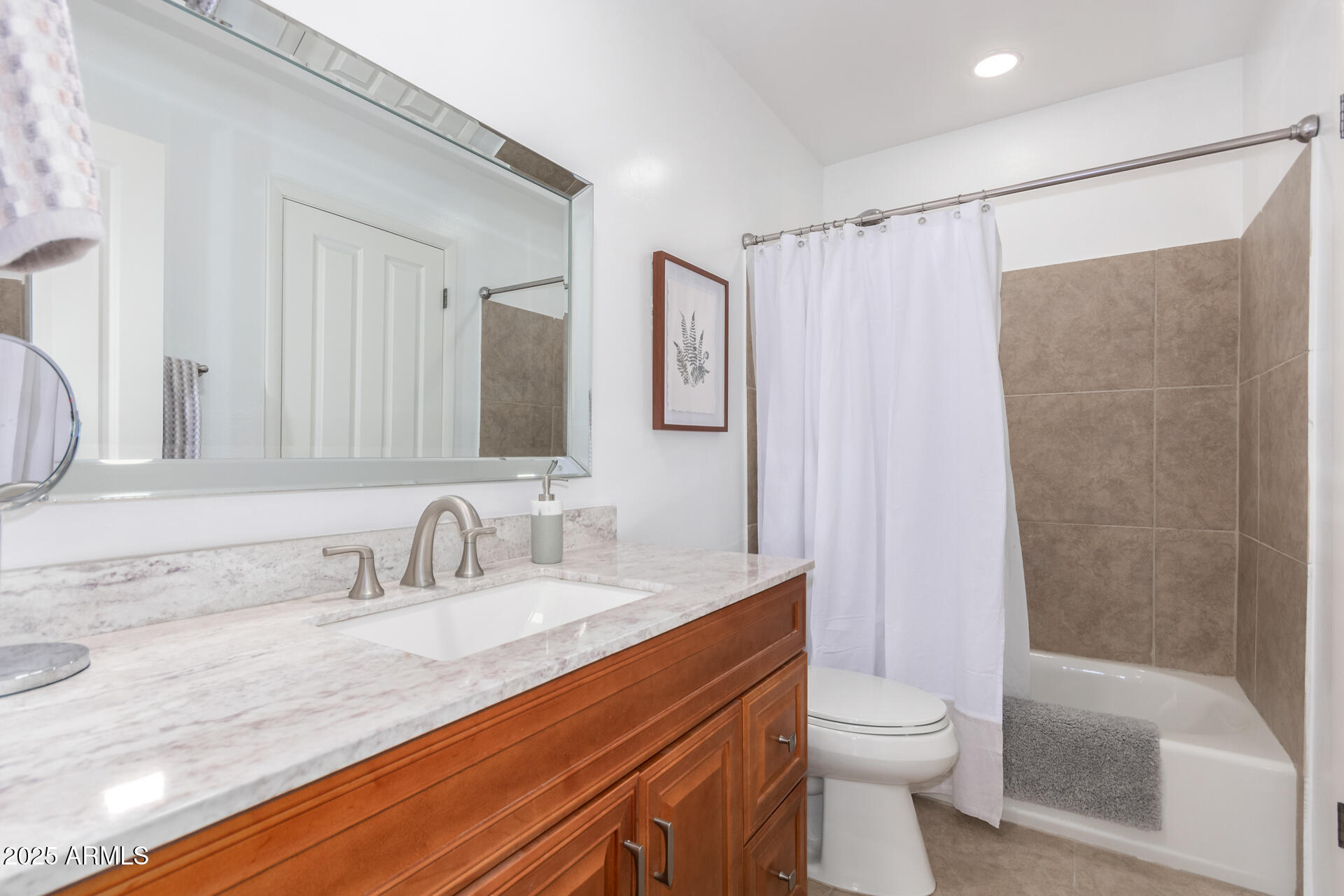 8490 East Chaparral Road Scottsdale, AZ 85250 - Photo 21 of 27 a bathroom with a sink a toilet and shower