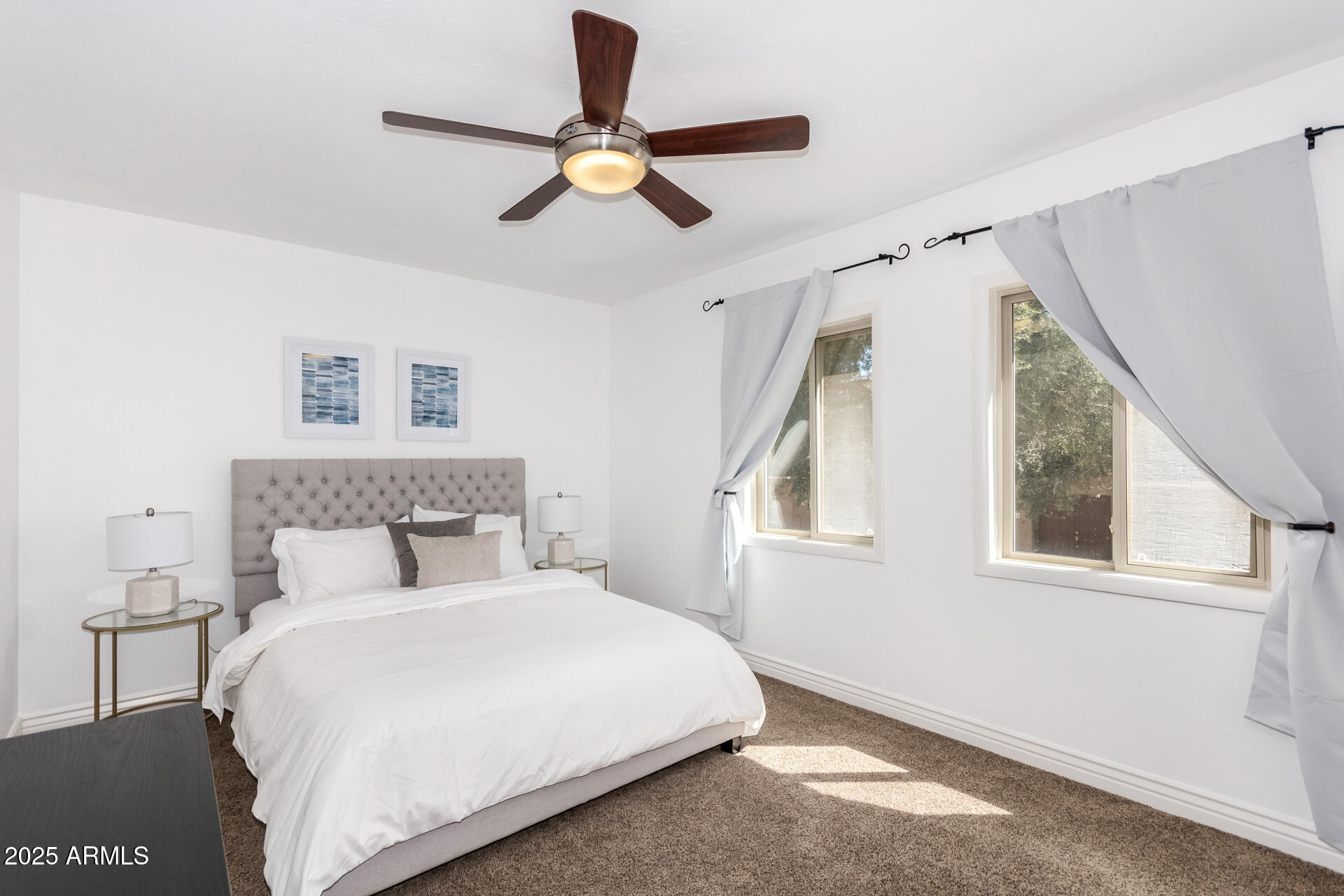 8490 East Chaparral Road Scottsdale, AZ 85250 - Photo 22 of 27 a bedroom with a large bed and a window