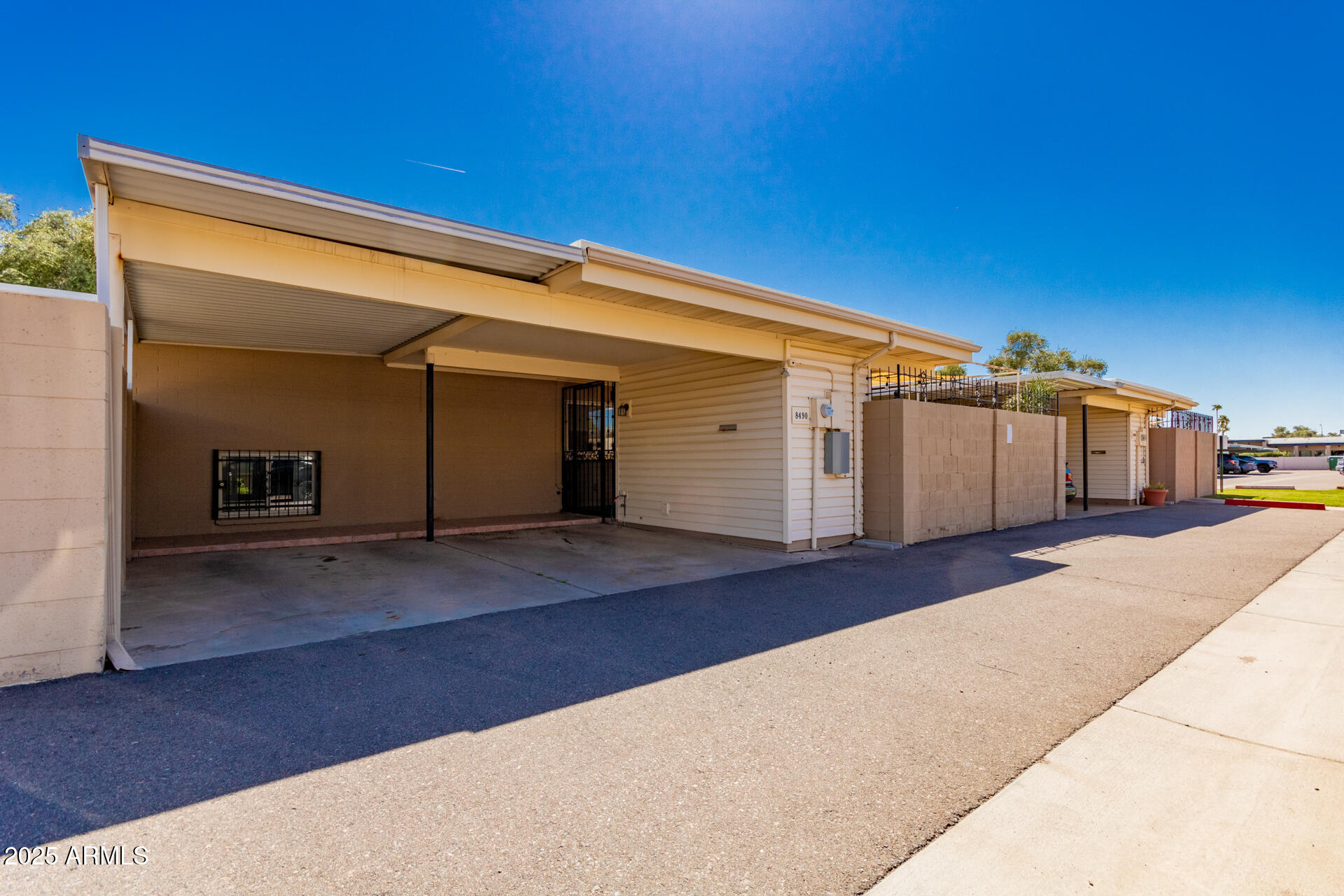 8490 East Chaparral Road Scottsdale, AZ 85250 - Photo 27 of 27 a view of a street with a garage