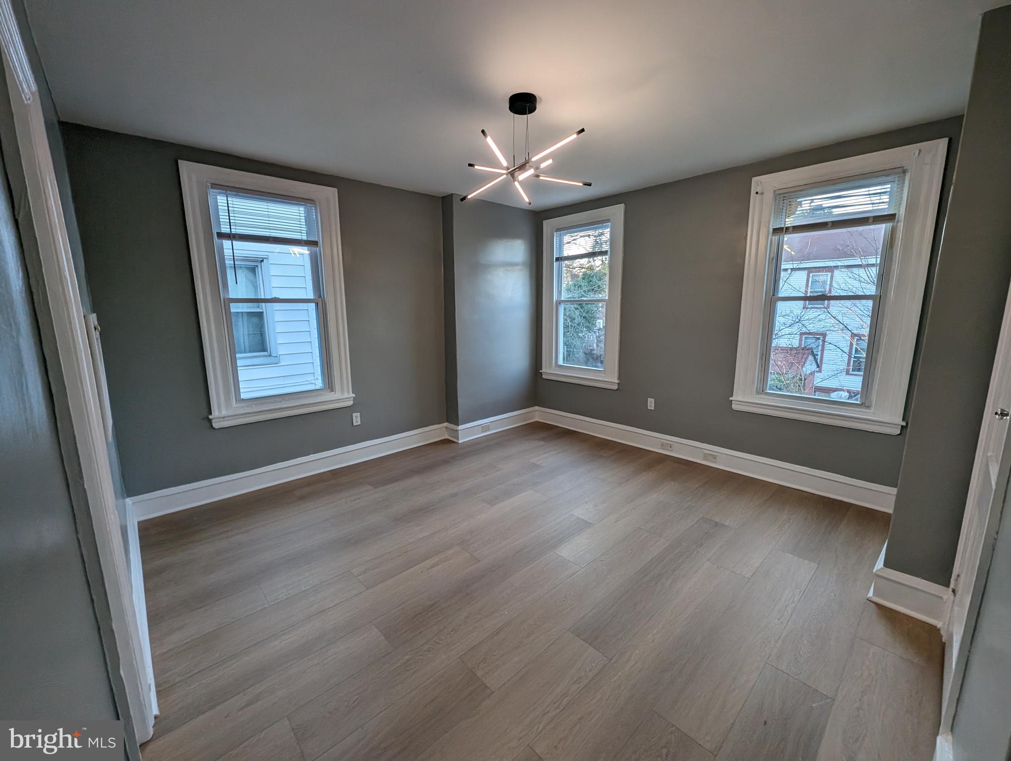 5750-52 Rising Sun Avenue, Unit 2A Philadelphia, PA 19120 - Photo 2 of 22 a view of livingroom with window hardwood floor and cabinet