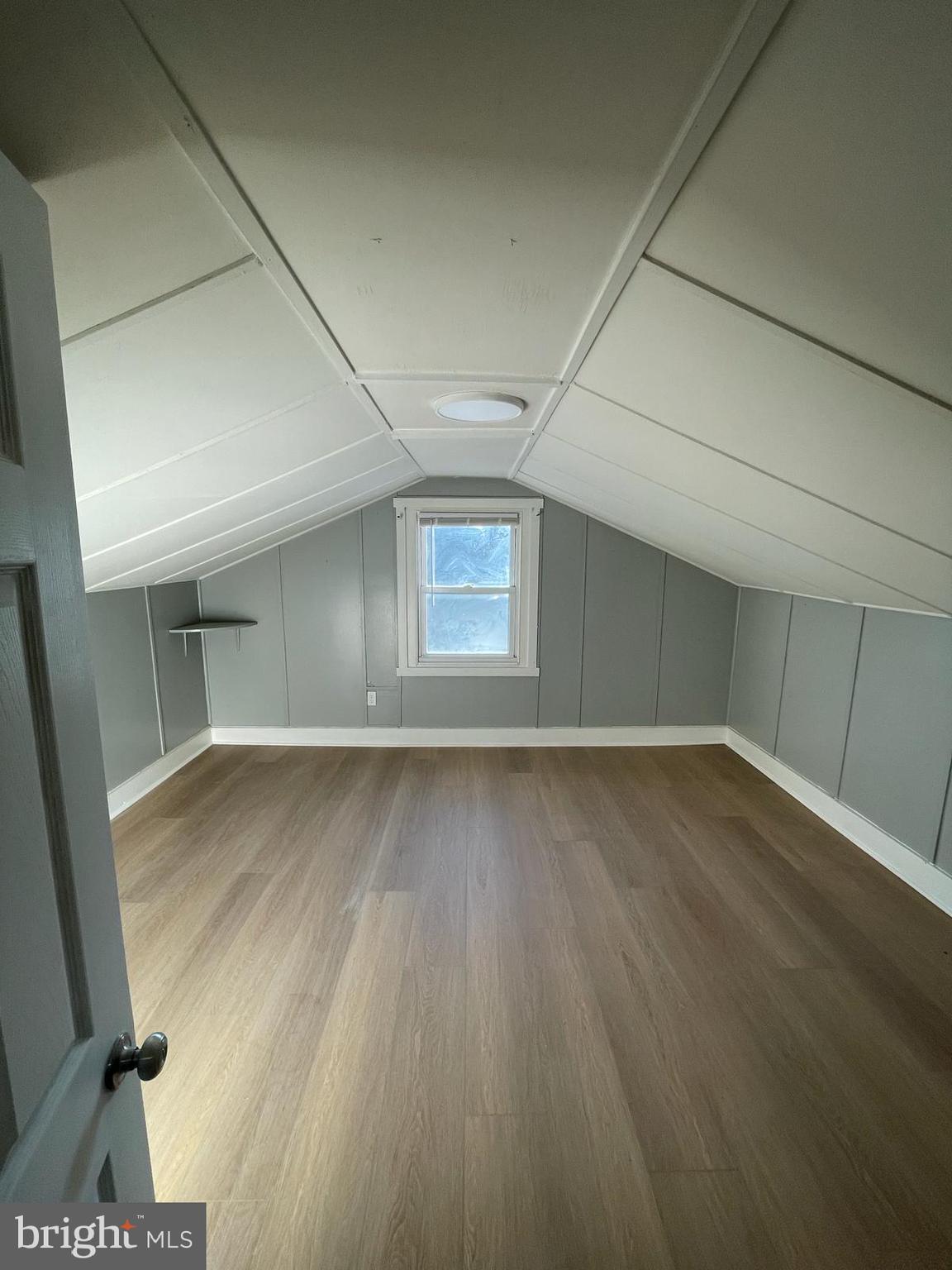 5750-52 Rising Sun Avenue, Unit 2A Philadelphia, PA 19120 - Photo 7 of 22 an empty room with wooden floor and windows