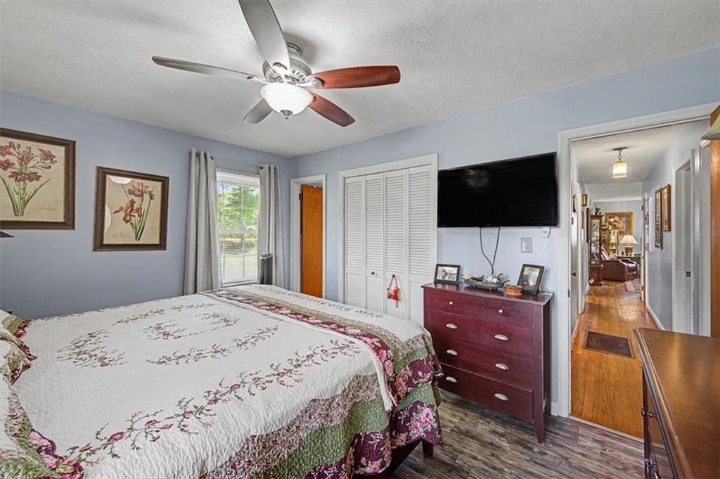 71 North Avery Road Northwest Rome, GA 30165 - Photo 23 of 42 a bedroom with a bed and a flat screen tv