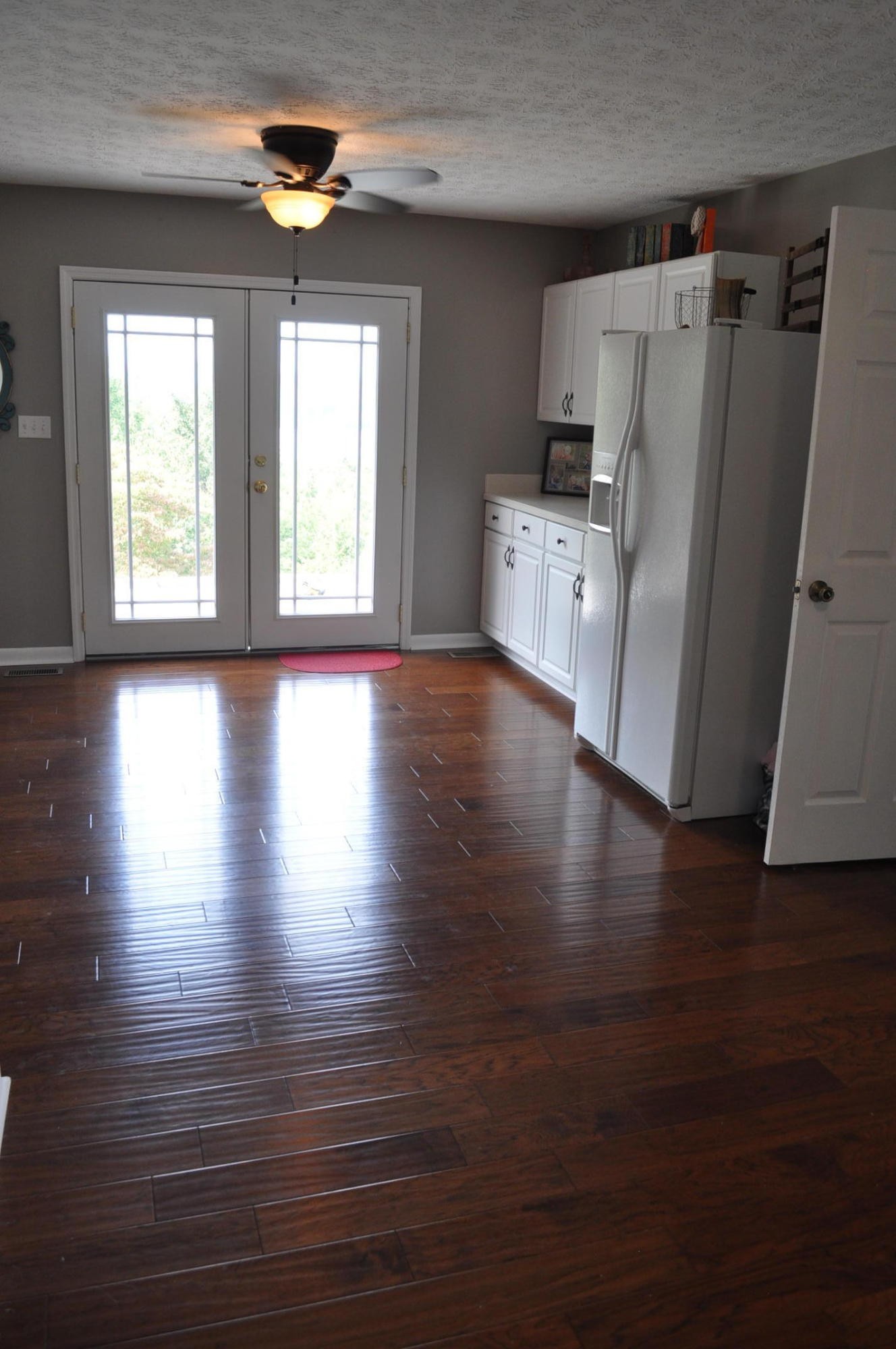 256 Rench Road Kingston, TN 37763 - Photo 6 of 23 a kitchen with stainless steel appliances wooden floors and wooden cabinets
