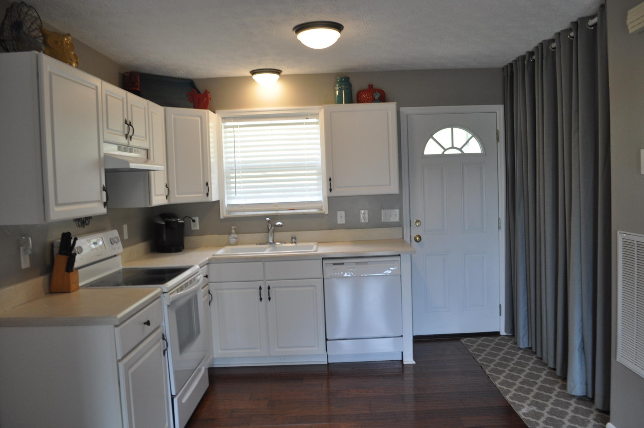 256 Rench Road Kingston, TN 37763 - Photo 7 of 23 a kitchen with granite countertop white cabinets and white appliances
