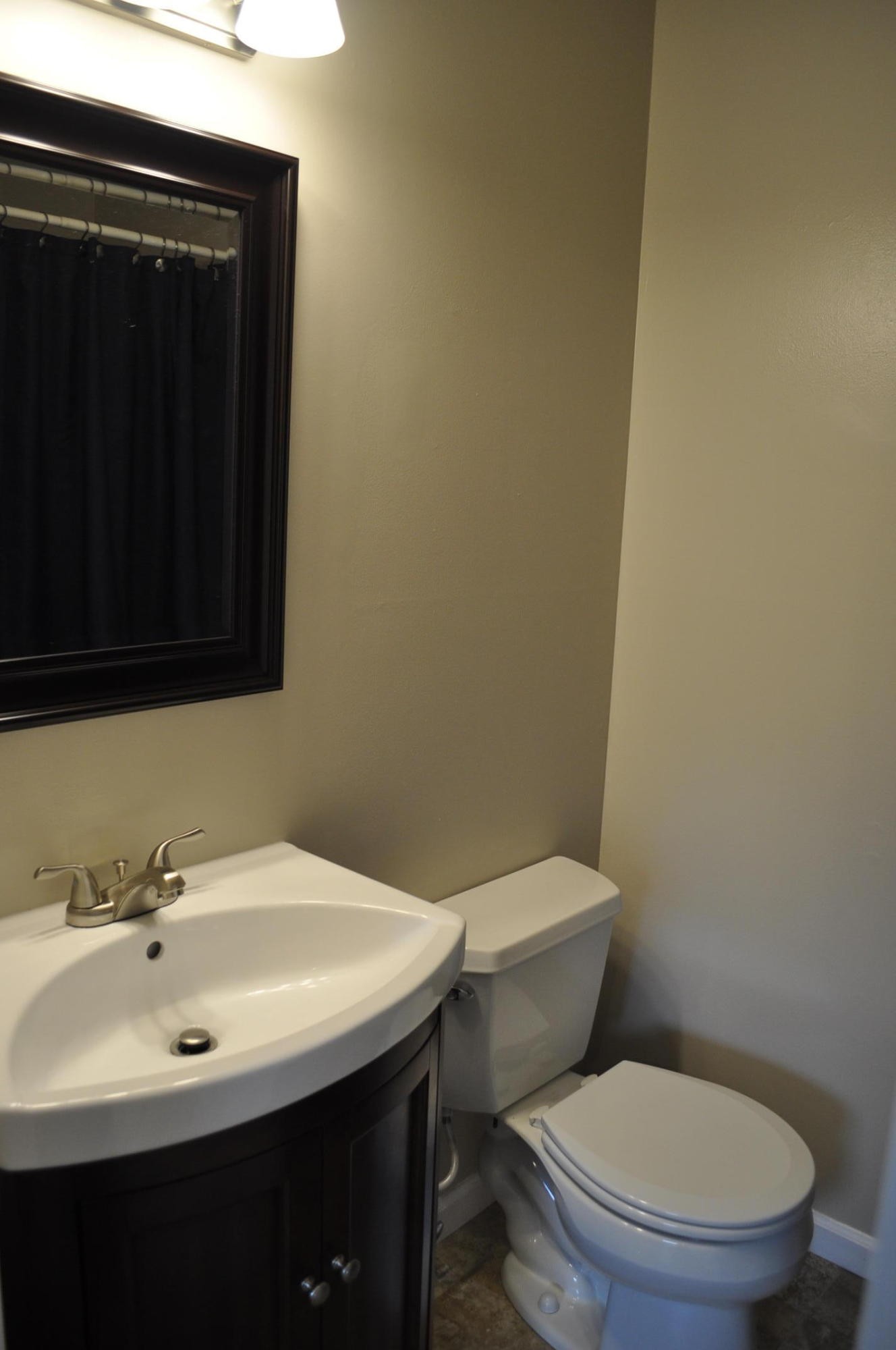 256 Rench Road Kingston, TN 37763 - Photo 10 of 23 a bathroom with a toilet a sink and mirror