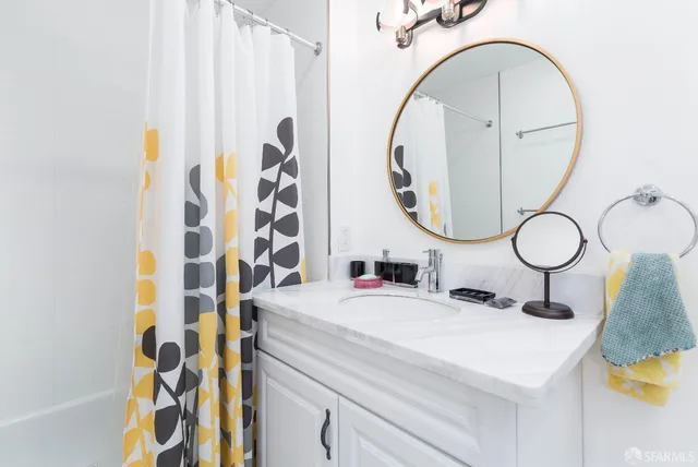 a bathroom with a sink and a mirror