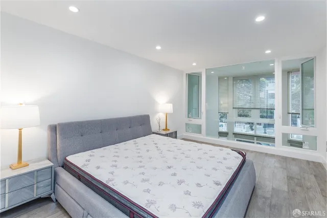 a bedroom with a bed and window