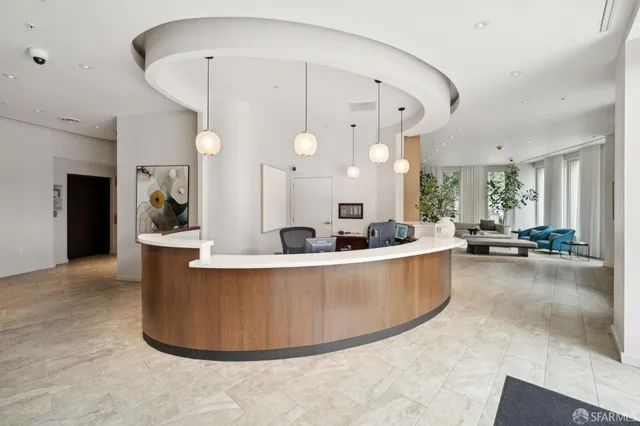 a view of a living room and kitchen